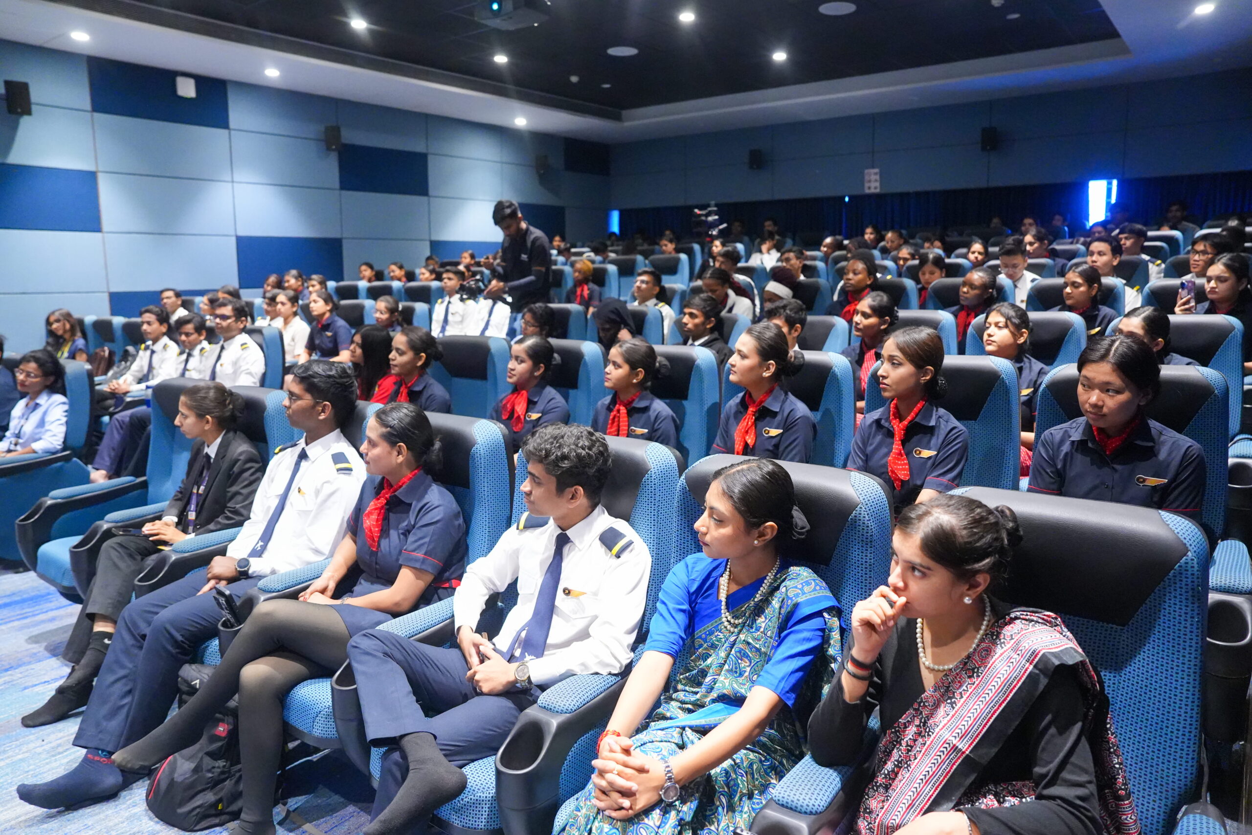Aviation students in uniform listening to Captain Arveen Kaur at PU