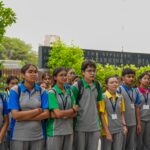 "Student-built scale models of iconic contemporary buildings at Parul University" | Models of global architectural icons on display; caption references the study module.