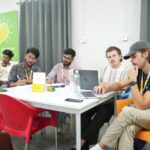 Founders conducting field research and customer interviews to validate a startup idea