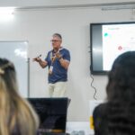 A founder mapping and testing startup assumptions on a board, as taught at Parul University